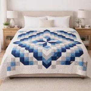 May include: A bed quilt featuring a geometric star pattern in shades of navy blue, light blue, and white. The design consists of small square fabric pieces arranged in a symmetrical, multi-layered star motif on a white background.