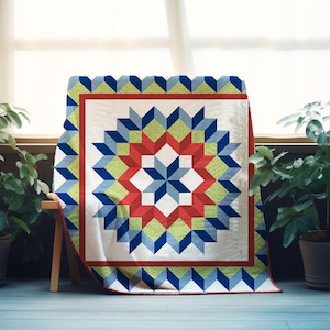 May include: A colorful quilt with a starburst design. The quilt features a white center with a red, blue, and green geometric pattern. The quilt is draped over a wooden bench, with plants in the background. The quilt's dimensions are not visible.