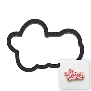 May include: A dark gray cookie cutter shaped like a cloud with a rounded outline. Next to it is a small square image of a light pink cookie decorated with the word love in dark pink icing, accented with tiny red and white heart-shaped sprinkles.