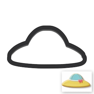 May include: Black metal cookie cutter shaped like a sun hat. The cutter features a wide brim and a curved crown. A small image shows a finished cookie, a yellow hat with a blue crown and a pink bow.