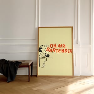 May include: A framed poster with a pale yellow background displays a cartoon illustration of a bartender and the text "OH MR. BARTENDER" in red. The frame is wooden, and the poster is in a room with light walls and a wooden floor.