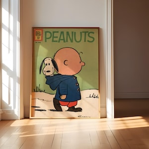 Può includere: Copertina di fumetto vintage incorniciata di "Peanuts" con Charlie Brown e Snoopy. L'opera mostra Charlie Brown con un cappotto blu con Snoopy sulla spalla. Il titolo "PEANUTS" è in lettere verdi, con "Dell" e il prezzo in alto a sinistra.