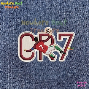May include: Embroidered patch featuring a soccer player in a red and white uniform kicking a soccer ball. The patch includes the letters "CR7" in a burgundy color with a white outline, and the number "7". The patch is on a blue denim background.