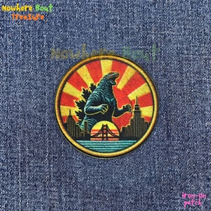 May include: A white ceramic mug with a black handle and the text "But First, Coffee" in a bold, black font. The mug is set against a blurred background, suggesting a cozy setting.