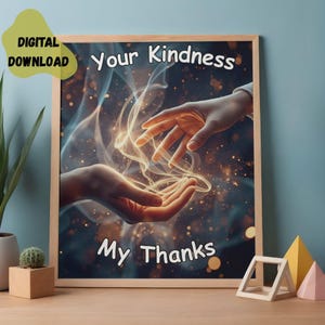 May include: A framed print with the words "Your Kindness My Thanks" in white. The artwork depicts two hands reaching towards each other with glowing light and smoke-like effects. The words "Digital Download" are in a yellow circle in the upper left corner.