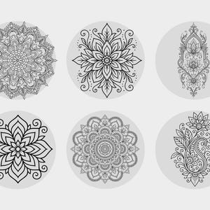 May include: Six black and white mandala designs on a light grey background. The mandalas feature intricate floral and geometric patterns, each within a circular frame. The designs vary in complexity, showcasing detailed line work and symmetrical arrangements.