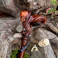 Skull Wooden Walking Cane - Ergonomic Palm Grip Handle Wood Carved Walking stick with skull head for men women Unique designer Art Goth product logo