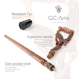 May include: A wooden walking stick with a detailed eagle carving on the handle. The handle is designed for a comfortable grip. The shaft is made of solid oak wood and has a rubber tip. The text "GC-Artis craft of canes" is visible on the image.