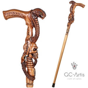 Full cane shown upright and assembled on white background. Intricate snake coils and skull carving extend along the shaft. GC-Artis handmade cane is both durable and collectible, merging functionality with artistic expression.