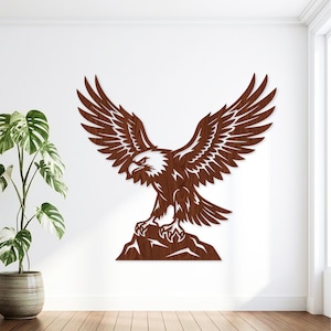 May include: A wall-mounted eagle cutout featuring a dark brown wood grain finish. The eagle is depicted with its wings fully spread in an upward position, perched atop a jagged rock formation. The design showcases sharp, angular cutouts.