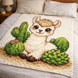 May include: A crocheted blanket featuring a smiling llama with brown and beige fur, and large, dark eyes. The blanket also includes green cacti and a light beige background. The blanket is on a bed with white pillows.