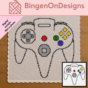 Peut inclure: Un modèle de crochet numérique présentant un graphique pixélisé d'une manette de jeu vidéo. Le design comprend une croix directionnelle grise, un bouton rouge, un bouton B vert, un bouton A bleu et quatre boutons jaunes sur un fond gris clair.