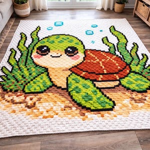 May include: A large, rectangular rug featuring a pixelated design of a cartoon sea turtle. The turtle has a green head and flippers, a red-brown shell, and is surrounded by green seaweed and blue bubbles on a white background.