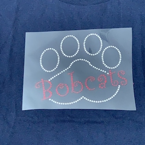 Iron on Bling Rhinestone red Bobcats paw transfer - Perfect to make for a tee.  Great for kids or adults cheer on your favorite mascot