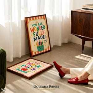Two framed prints with Bible verses, "You are wonderfully made" and "Walk by faith".