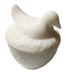 May include: A set of three ceramic mugs with a speckled, matte finish. The mugs are in shades of cream, light gray, and dark gray. Each mug has a simple, minimalist design, perfect for coffee or tea.