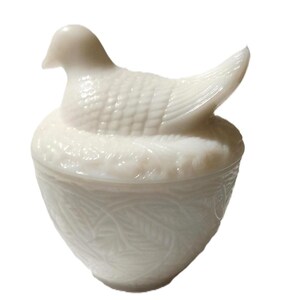 May include: A set of three ceramic mugs with a speckled, matte finish. Each mug features a different color: light blue, cream, and gray. The mugs have a simple, modern design and a comfortable handle.