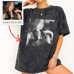 May include: Dark gray oversized t-shirt with a black and white photo print of a person. The shirt has a vintage, washed-out look. A small photo with the text "YOUR PHOTO HERE" is on the left side of the shirt.