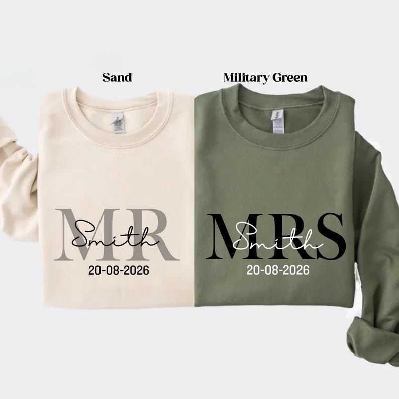 May include: Two crewneck sweatshirts, one sand-colored and one military green. The sand sweatshirt has "MR Smith" and the date "20-08-2026" printed on it. The green sweatshirt has "MRS Smith" and the same date.