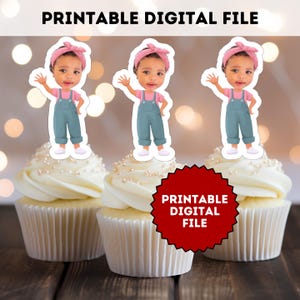 May include: Three cupcakes with white icing and pearl sprinkles, each topped with a cartoon image of a child wearing a pink headband, pink shirt, and blue dungarees. The text "PRINTABLE DIGITAL FILE" is at the top and on a red burst.