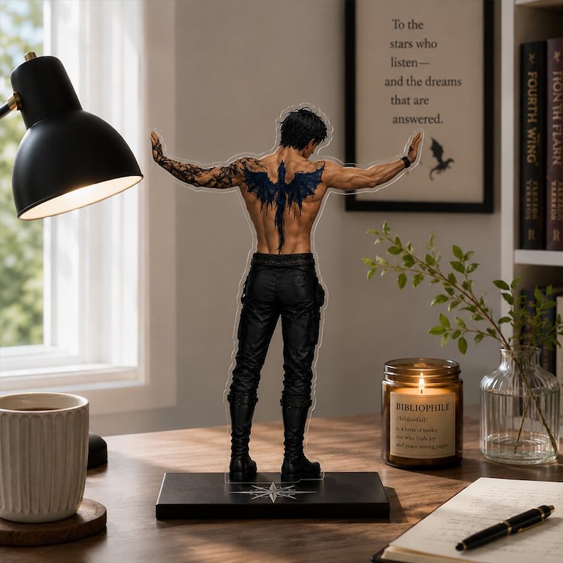 May include: An acrylic standee featuring a shirtless male figure from the back, displaying a large black dragon tattoo across the shoulders and back, wearing black pants and boots, standing on a rectangular base with a compass rose design.