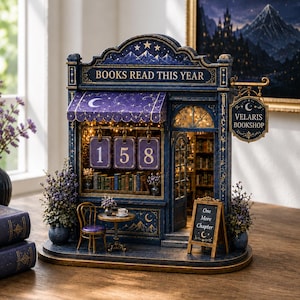 May include: A miniature dark blue bookstore model titled Books Read This Year with a hanging Velaris Bookshop sign, a purple awning with stars and moons, a small table with a chair, and a sidewalk sign that reads One More Chapter with a moon icon.
