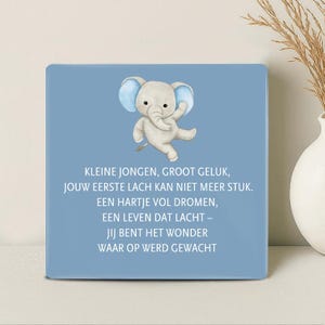 May include: A square, light blue decorative plaque featuring a watercolor illustration of a gray elephant with blue ears. The elephant is waving. Text in white reads: "KLEINE JONGEN, GROOT GELUK...WAAR OP WERD GEWACHT."