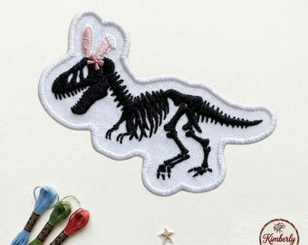 Dinosaur Skeleton Embroidered Patch, Cute T-Rex Fossil with Pink Bow Badge, Girly Dino Iron On Patch for Jackets Bags