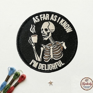 May include: Black circular patch with the text "AS FAR AS I KNOW I'M DELIGHTFUL" surrounding a skeleton holding a coffee cup. The skeleton is white and tan, with a black background. The patch is embroidered.