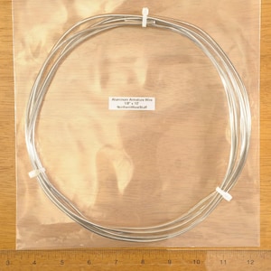 May include: A bundle of silver aluminum armature wire, 1/8" x 10", is coiled inside a clear plastic bag. The text "Aluminum Armature Wire 1/8" x 10" NorthernWestStuff" is printed on a white label.