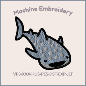 May include: Machine embroidery design of a cartoon whale shark with a light blue body and white spots, outlined in black. The text "Machine Embroidery" is above the design. The image also includes size options: 5", 4", and 3".