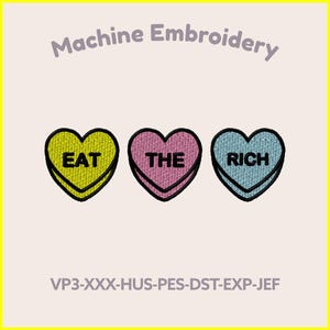 May include: Machine embroidery design featuring three heart-shaped patches. Each heart is a different color: yellow, pink, and blue. The text "EAT THE RICH" is embroidered on the hearts. The design is available in two sizes: 7 inches and 4 inches.