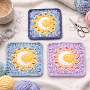 May include: Three square crochet coasters with a sun and moon design. The coasters are in shades of blue, yellow, white, and pink. The image also includes yarn, scissors, and a cup of coffee.
