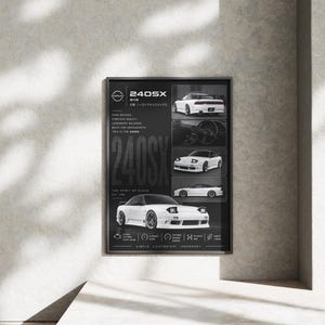 May include: A black rectangular poster featuring a white Nissan 240SX sports car. The design includes multiple views of the vehicle, the text 240SX, and technical specifications. The layout is organized with a large car image at the bottom.