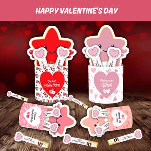 May include: Valentine's Day themed gift sets featuring star-shaped characters holding heart-shaped wands. The sets include containers with heart and XO patterns, and the text "Happy Valentine's Day".