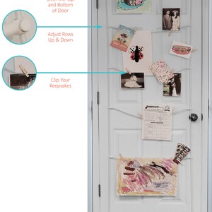 May include: White door with a white string hanging across it. The string is attached to two white hooks at the top and bottom of the door.  The string has several clothespins holding up various pictures and papers.