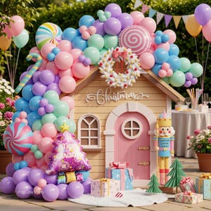 May include: A playhouse decorated with a large balloon arch in pastel pink, blue, purple, and green. It features a white wreath, a nutcracker figure, a Christmas tree balloon, and wrapped gifts. The word Christmas is written above the door.