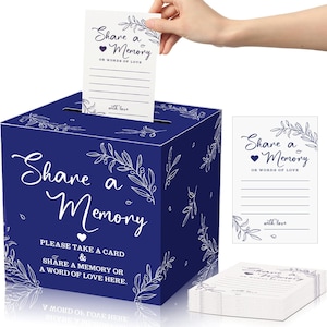 May include: A navy blue memory box with white floral accents and the text "Share a Memory." A hand inserts a card into the box. The card and box feature the same design. A stack of cards is visible.
