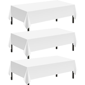 May include: Three rectangular tables with white tablecloths and dark legs are displayed. The tablecloths drape over the edges of the tables. The tables are arranged in a vertical stack, showcasing a clean and simple design.