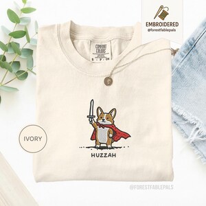 Funny Corgi Sword Shirt, Embroidered Huzzah Corgi Shirt, Medieval Dog Tee, Cute Dog Lover Gift, Renaissance Faire Shirt, Comfort Colors Ivory