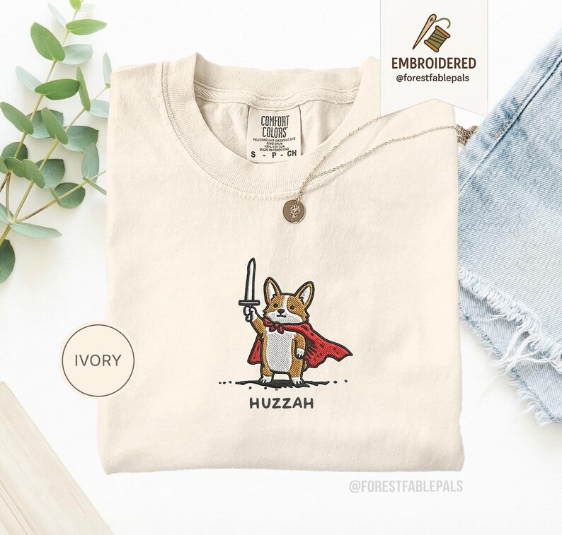 Funny Corgi Sword Shirt, Embroidered Huzzah Corgi Shirt, Medieval Dog Tee, Cute Dog Lover Gift, Renaissance Faire Shirt, Comfort Colors Ivory