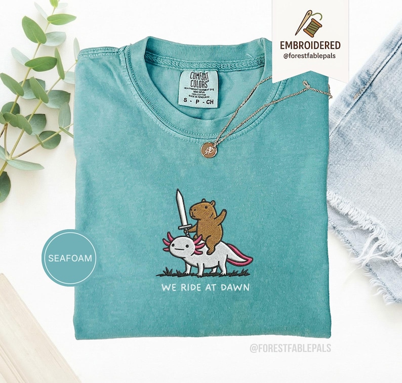 Embroidered Capybara Axolotl Shirt - We Ride at Dawn, Funny Capybara Shirt, Ren Faire Clothing, Cute Animal Gift, Medieval Shirt, CC 1717 Seafoam