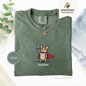 Funny Corgi Sword Shirt, Embroidered Huzzah Corgi Shirt, Medieval Dog Tee, Cute Dog Lover Gift, Renaissance Faire Shirt, Comfort Colors Moss