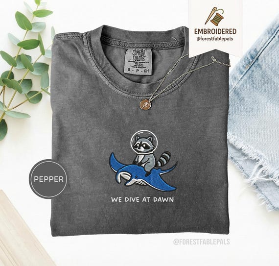 Embroidered Raccoon Manta Ray Shirt - We Dive at Dawn, Funny Ocean Animal Shirt, Cute Raccoon Tee, Marine Life Gift, Comfort Colors®