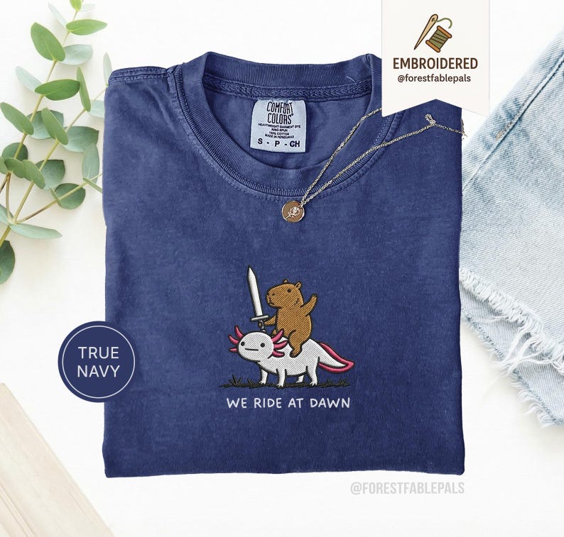 Embroidered Capybara Axolotl Shirt - We Ride at Dawn, Funny Capybara Shirt, Ren Faire Clothing, Cute Animal Gift, Medieval Shirt, CC 1717 True Navy