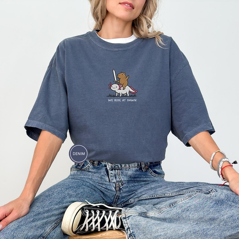Embroidered Capybara Axolotl Shirt - We Ride at Dawn, Funny Capybara Shirt, Ren Faire Clothing, Cute Animal Gift, Medieval Shirt, CC 1717 Denim