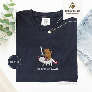 Embroidered Capybara Axolotl Shirt - We Ride at Dawn, Funny Capybara Shirt, Ren Faire Clothing, Cute Animal Gift, Medieval Shirt, CC 1717 Black