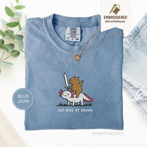 Embroidered Capybara Axolotl Shirt - We Ride at Dawn, Funny Capybara Shirt, Ren Faire Clothing, Cute Animal Gift, Medieval Shirt, CC 1717 Blue Jean