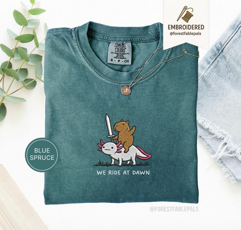 Embroidered Capybara Axolotl Shirt - We Ride at Dawn, Funny Capybara Shirt, Ren Faire Clothing, Cute Animal Gift, Medieval Shirt, CC 1717 Blue Spruce