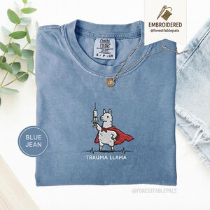 Embroidered Trauma Llama Shirt, Funny Nurse Shirt, Trauma Nurse Gift, ER Nurse Tee, Healthcare Worker Gift, Cute Llama Comfort Colors Shirt Blue Jean